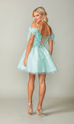 A woman models the Shoulder-Bow Short Glitter Homecoming Dress 3363 in light blue, featuring off-the-shoulder sleeves, a corset lace-up back, and sparkling fabric while looking over her shoulder.