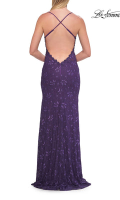 A woman shown from behind is wearing the La Femme 33647 Beaded Long Lace Prom Dress, featuring a sleeveless design in purple with a low open back and crisscross straps.