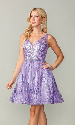 A woman stands against a plain background wearing the Dancing Queen 3364, a short lavender glitter-print homecoming dress with floral sequin embellishments, sleeveless design, deep V-neckline, and fitted waist.