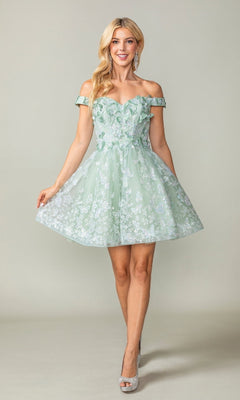 Woman wearing a light green off-shoulder dress with floral patterns on a plain background