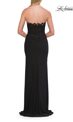 Woman wearing the Lace-Trim Strapless Long Prom Gown: La Femme 33704, featuring lace detailing on the bodice, shown from the back.