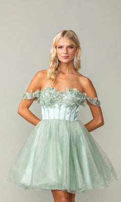 Woman wearing a light green off-shoulder dress with floral embellishments against a plain background
