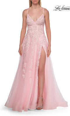 A woman wears the La Femme 33715 Floral Lace Embroidered Prom Dress in baby pink, featuring a sleeveless design, spaghetti straps, and a high slit, paired with neutral heels against a white background.