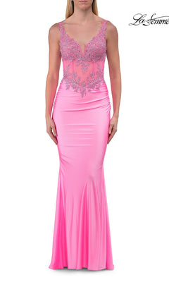 Wearing the La Femme 33731 Beaded-Bodice Long Prom Dress in baby pink, she stuns in a fitted, floor-length gown featuring a deep V-neckline and an illusion lace bodice embellished with sparkling beaded floral details.