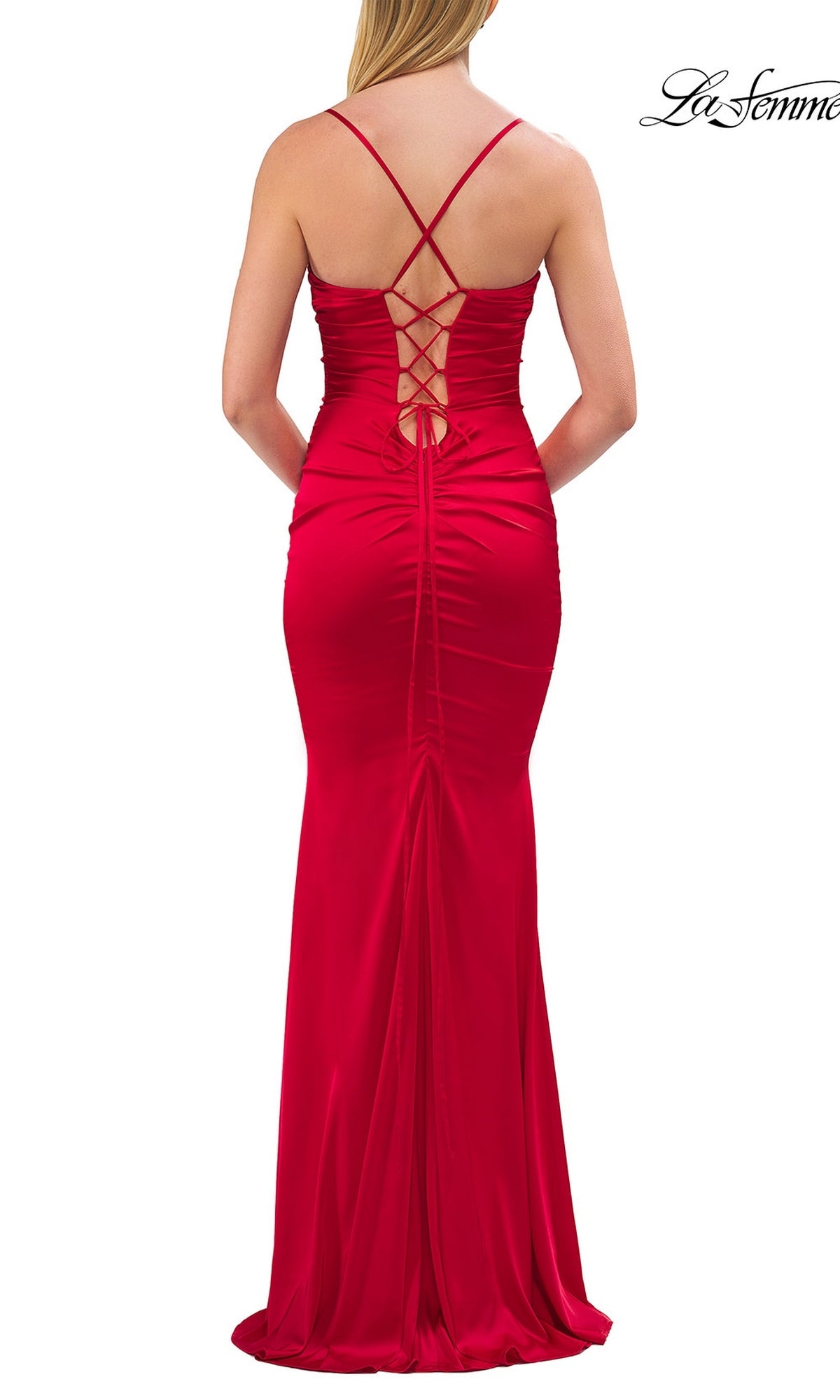 A woman viewed from behind wears the Criss-Cross Open-Back Prom Gown: La Femme 33764, a floor-length red dress featuring thin crisscross straps and lace-up back detailing.
