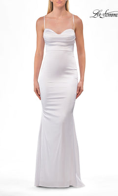 A woman wearing the Criss-Cross Open-Back Prom Gown: La Femme 33764 in white, featuring thin straps and a sweetheart neckline, stands against a plain white background.