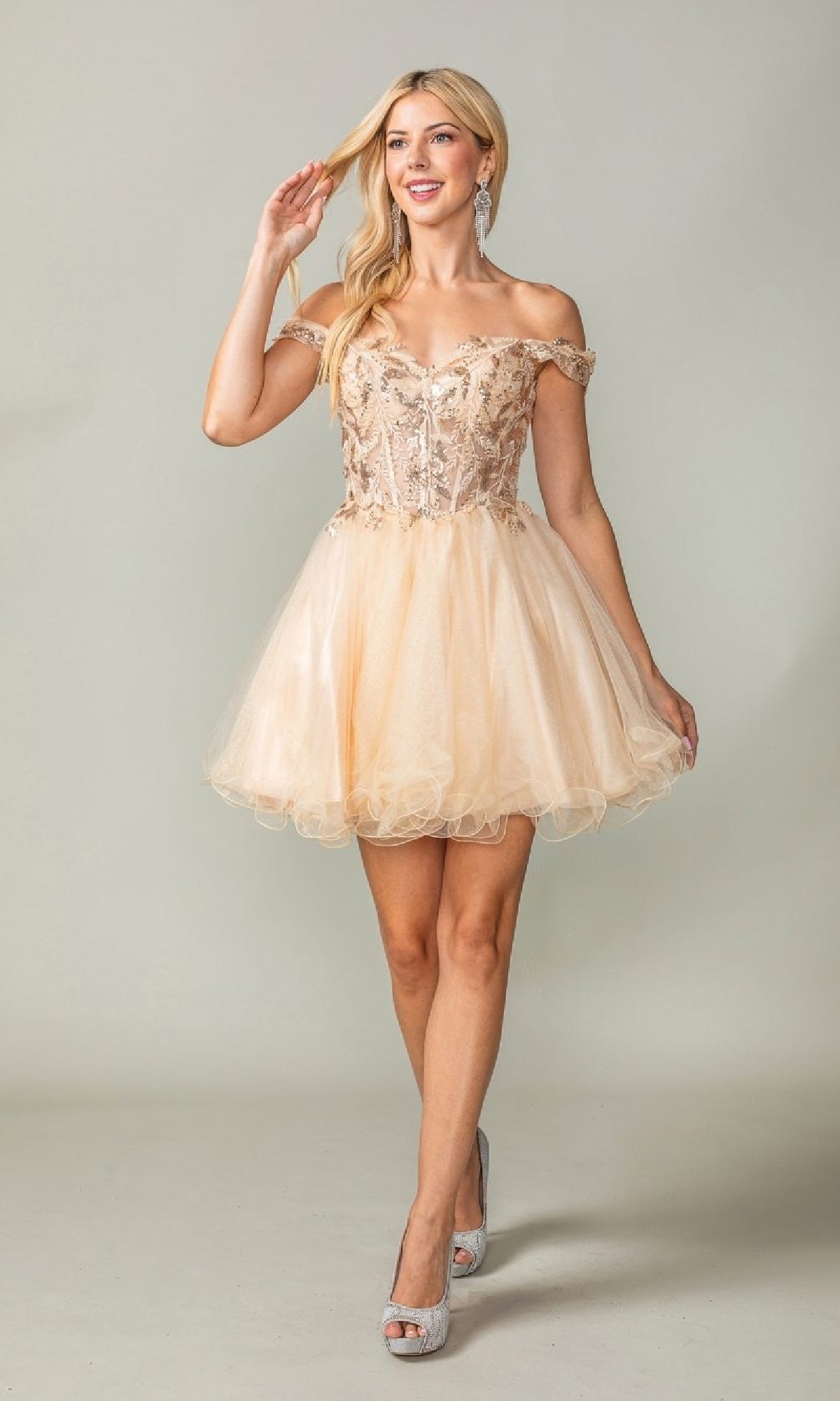 Woman wearing a beige off-shoulder dress with a plain background