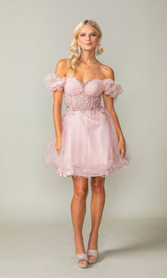 A woman wears the Ruffle-Sleeve Short Corset Homecoming Dress 3379 with sheer puff sleeves and an embellished bodice, paired with silver heels, standing against a plain background.