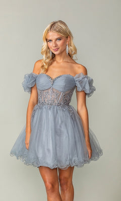A woman stands against a plain background wearing the Ruffle-Sleeve Short Corset Homecoming Dress 3379, featuring light blue fabric, off-the-shoulder ruffle sleeves, lace detailing, and a fitted corset bodice.