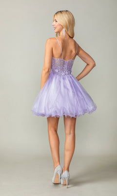 A woman stands facing away, wearing the Sheer-Waist Short Babydoll Homecoming Dress 3382—a light purple dress with a sheer lace bodice, spaghetti straps, and tulle skirt—paired with silver high heels and long earrings.
