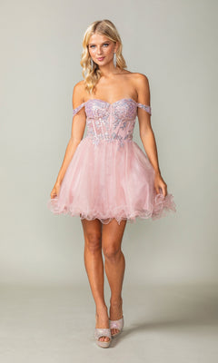 A woman wears the Dancing Queen 3383 short corset homecoming dress featuring silver glitter embellishments, a fitted sheer bodice, and a tulle skirt, paired with light-colored heels.