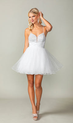 A woman wears the Lace-Up Short Babydoll Homecoming Dress 3385, featuring a fitted bodice and flared skirt, as she smiles and holds her hair against a plain light background.