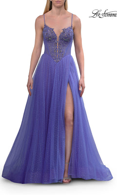 A woman wearing the Sheer-Corset Long Prom Ball Gown La Femme 33860 in periwinkle—a sleeveless, long A-line dress featuring a deep V-neckline, floral embellishments, sheer embroidered corset bodice, tulle skirt with a front thigh-high slit, and sparkling details.