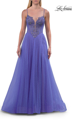 Dressed in the Sheer-Corset Long Prom Ball Gown: La Femme 33860, a woman showcases a floor-length, sleeveless purple gown adorned with floral applique and sparkling beaded accents. This elegant A-line prom dress features slender straps, a plunging V-neckline, and a sheer embroidered corset bodice that gracefully transitions into a voluminous tulle skirt.
