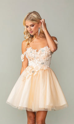 A woman in the Off-Shoulder Short Babydoll Homecoming Dress 3388, crafted from cream tulle with floral appliqués, stands against a plain backdrop and gently touches her hair.