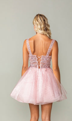 A woman with wavy blonde hair models the Embroidered-Bodice Short Lace-Up Hoco Dress 3390, featuring a flared glitter skirt and lace-up back, standing against a plain background.