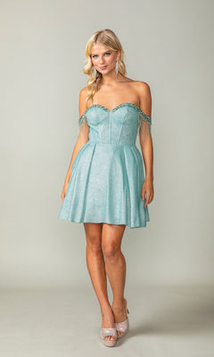 A woman wears the Fringed Off-Shoulder Short Homecoming Dress 3392 in light blue, featuring a fitted corset bodice and flared knee-length skirt, paired with sparkling silver high-heeled shoes.