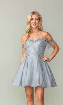 A woman models the Fringed Off-Shoulder Short Homecoming Dress 3392 in silver glitter, featuring beaded fringe sleeves and a subtle corset bodice, set against a plain light gray background.
