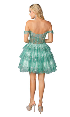 A woman is seen from the back in the Dancing Queen 3400 Short Ruffled Hoco Dress, featuring tiered green ruffles, sparkly accents, and high heels.