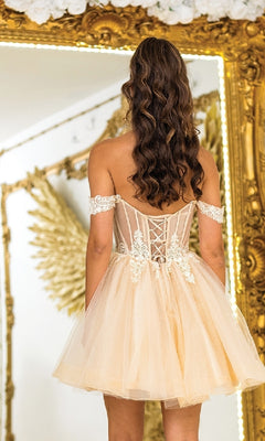 A woman with long wavy hair wears the Dancing Queen 3410 Fit-and-Flare Glitter Hoco Dress in front of a large ornate mirror with gold detailing.