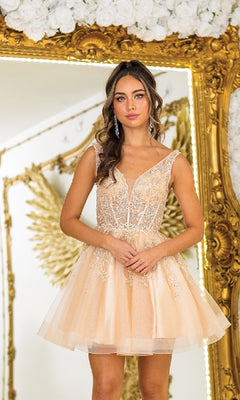 A woman wears the Lace-Up Short A-Line Prom Dress: Dancing Queen 3414, posing before a gold ornate mirror and wing decor, with white flowers adorning the top of the frame.