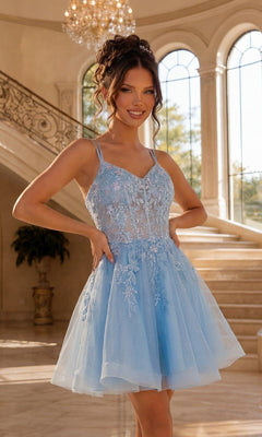 A woman stands indoors wearing the Dancing Queen 3415 Short Corset Prom Dress in Bahama Blue, featuring a sleeveless embroidered floral bodice and a tulle A-line skirt. A staircase and large windows appear in the background.