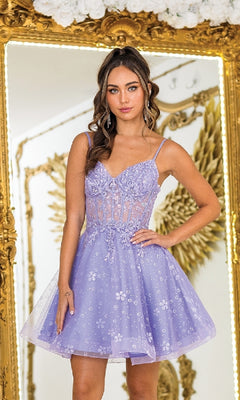 A woman stands before a gold ornate mirror wearing the Sheer-Corset Short Hoco Dress: Dancing Queen 3419—a lavender cocktail dress with thin straps, floral embroidery, and a sheer bodice.