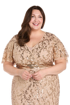 A woman smiles against a white background, wearing the beige Plus-Size Gold Formal Dress: R&M Richards 3425W adorned with sequins.