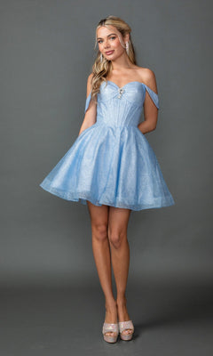 A woman poses against a gray background wearing the Dancing Queen 3425 short prom dress in light blue, featuring an off-the-shoulder neckline, flared glitter tulle skirt, and paired with silver high heels.