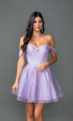 A woman poses in front of a plain gray background, wearing the Dancing Queen 3425—a short, off-the-shoulder lavender sparkly prom dress with a fitted bodice and flared skirt.