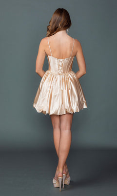 A woman stands with her back to the camera, modeling the Dancing Queen 3435 short homecoming dress—featuring a shiny champagne-colored bubble hem—paired with high-heeled shoes, set against a plain gray background.