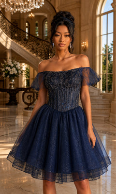 A woman wearing the Dancing Queen 3439 short homecoming dress in navy, featuring an off-shoulder beaded corset and a glitter tulle skirt, stands in an elegant grand foyer with marble floors and a curved staircase.