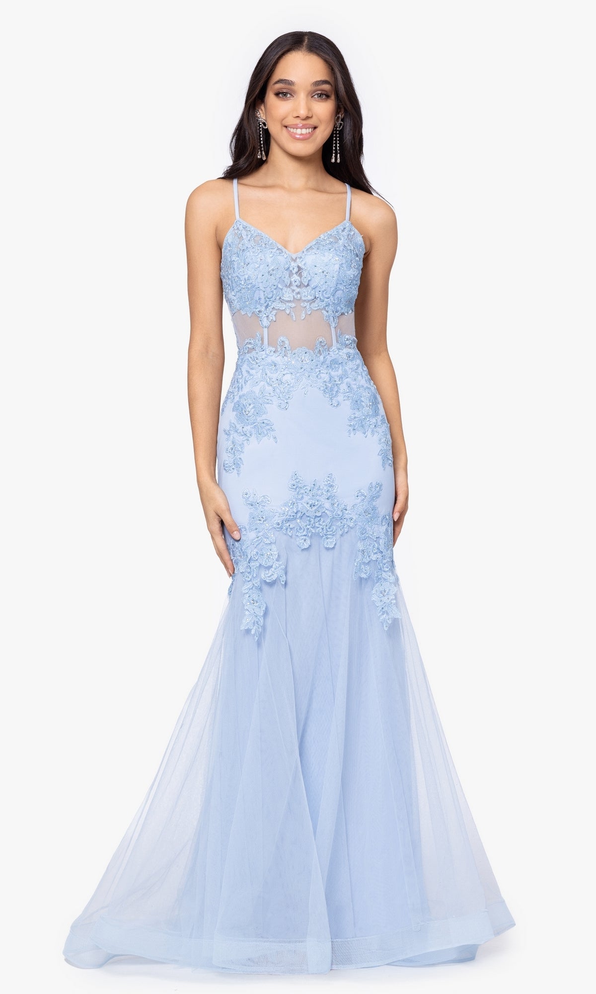 A woman models the Blondie Nites Long Mermaid Prom Dress 3448BN in light blue, featuring embroidered lace appliques, sheer panels, and a corset-style waist, standing against a plain white background.