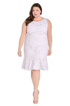 A woman stands facing forward in nude heels, wearing the R&M Richards 3506W Plus Knee Length Party Dress—an affordable sleeveless white lace dress with a floral design and ruffled hem.