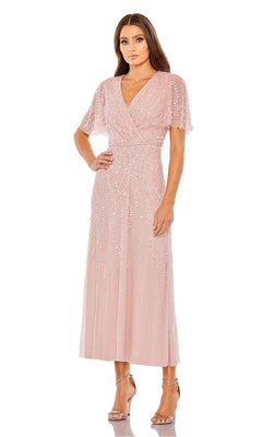 A woman wearing the Beaded Midi Semi-Formal Dress: Mac Duggal 35116 paired with metallic strappy heels stands against a white background.