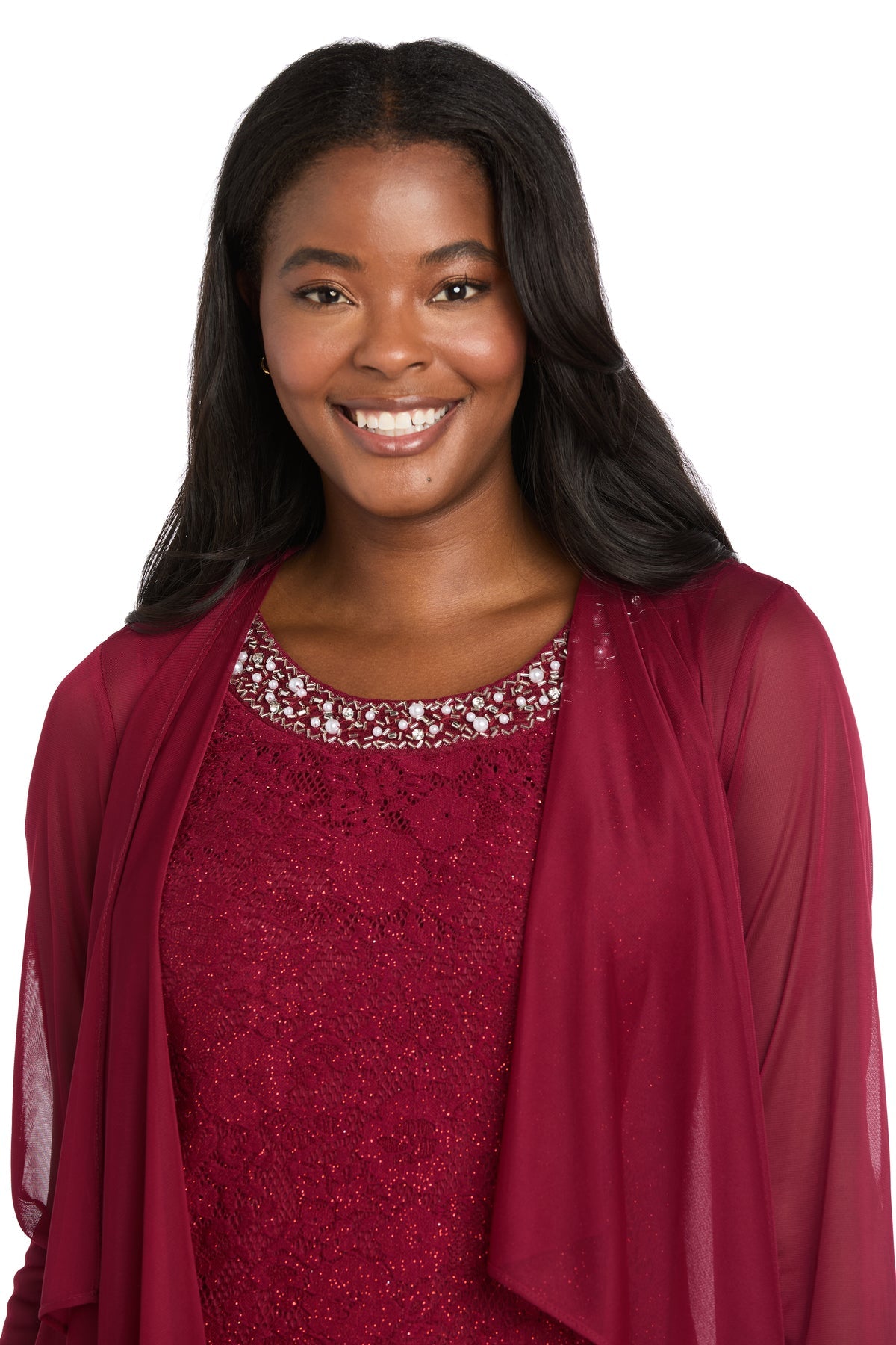Woman smiling in the R&M Richards 3594 Short Semi-Formal Jacket Dress, featuring a beaded neckline and matching sheer jacket, against a plain white background.