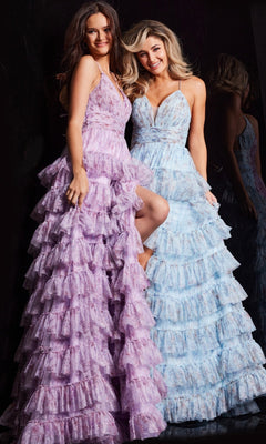 Two women stand side by side against a dark background, each wearing the Jovani 36571 Long Print Ruffled A-Line Prom Dress in lavender and light blue, both featuring spaghetti straps and V-necklines.