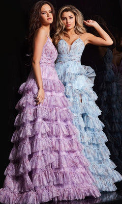 Two women pose side by side in Jovani 36571 Long Print Ruffled A-Line Prom Dresses—one in light purple, the other in light blue—both featuring elegant ruffled skirts, set against a dark background.