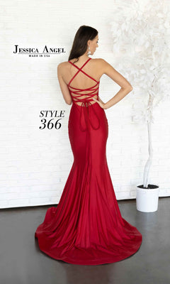 A woman models the Lace-Up Long Prom Dress: Jessica Angel 366, a floor-length red gown with an open back, crisscross straps, and a fitted silhouette.