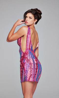 Woman posing in the Jovani Hot Pink Short Sequin Party Dress 36784—a sleeveless, backless mini dress with blue and red sequin patterns—looking over her shoulder against a plain background.