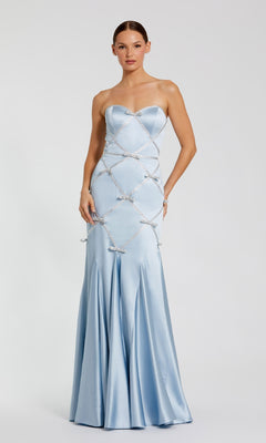 A woman wears the Mac Duggal 37000 strapless long blue formal dress, featuring a fitted bodice, flared skirt, and diamond-shaped beaded details—an elegant choice for evening events.