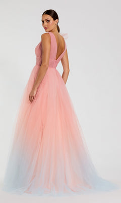 A woman wears the Long Formal Dress: Mac Duggal 37001, a sleeveless pink ombre ballgown with a gradient from pink at the top to light blue at the hem, standing against a plain background.