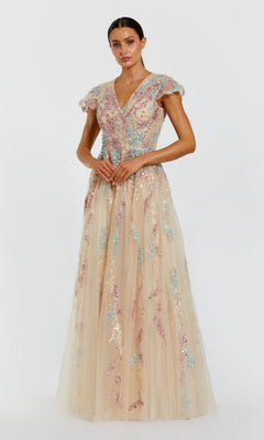 A woman stands against a plain light background wearing the Long Formal Dress: Mac Duggal 37014 in Nude Multi—a floor-length, cap-sleeve gown featuring pastel sequin floral patterns and a V-neckline. This elegant dress is an ideal choice for a stylish mother-of-the-bride.