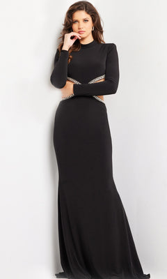 A woman with long brown hair wears the Jovani Long Prom Dress 37037, a fitted jersey gown with long sleeves and jeweled waist cut-outs, standing against a plain white background.
