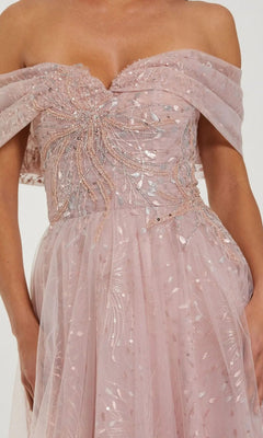 A close-up of a person wearing the Long Formal Dress: Mac Duggal 37083, a strapless blush pink gown adorned with intricate silver sequin and bead embellishments, featuring sheer draped off-the-shoulder details that elevate this embroidered tulle design into a stunning off-the-shoulder formal dress.