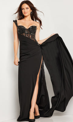 A woman poses against a white background in the Jovani Long Prom Dress 37094, a black fitted gown with a sweetheart neckline, sheer embellished bodice, and high slit for an elegant formal look.