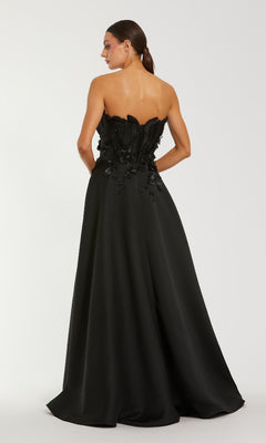 Black strapless gown with floral details on a white background