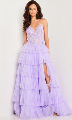 A woman wearing the Jovani Long Prom Dress 37190 with a ruffled tulle skirt, lace embellished bodice, deep V-neckline, and high leg slit stands against a plain white background.