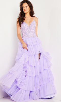 A woman stands against a plain light background wearing the Long Prom Dress 37190 by Jovani, featuring lavender ruffled tulle, a fitted lace-embellished bodice, and thin straps.