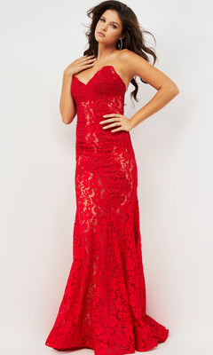A woman poses in the Long Prom Dress 37334 by Jovani—a strapless, floor-length red lace gown with a sweetheart neckline, fitted bodice, and flared hem—against a plain white background.